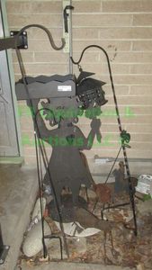 lot 324 image: Yard art including sheppards hooks, silhouette plant stand plus