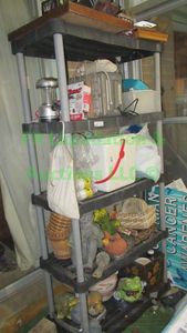 lot 310 image: Shelving unit and contents including Outdoor decor and more