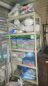 lot 314 image: Shelving unit and contents of Assorted sewing and quilting fabrics, & batting as shown