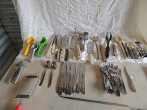 lot 43 image: Large lot of silverware including forks, knifes, shredder, lemon juicer, nut cracker, steak knifes and much more