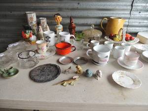 lot 44 image: Large lot of nick knacks including Germany plate with matching tea cups, glass bowls with handle full of glass fruit and veggies, rooster S&P shakers, 2 clover leaf candy dishes and more