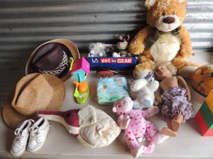 lot 54 image: Misc. childrens toys, bike helmet, blocks, dolls and straw hats