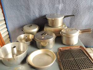lot 134 image: Lot of various pans. Pressure cookers x 2, large roasting pan, 2 waffle irons, 2 cornbread pans, 2 angel food pans,pots
