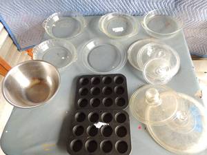 lot 135 image: 2 muffin pans one for 12 mini muffins, 5 pyrex round pans, 1 mediumsize mixing bowls, various glass lids