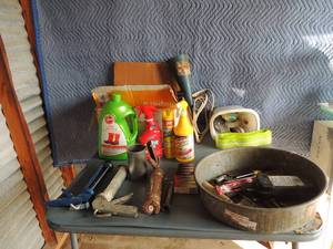 lot 141 image: Various tools, caulking guns x 3, oil pan, spark plugs, funnel, extension cord, and other misc.