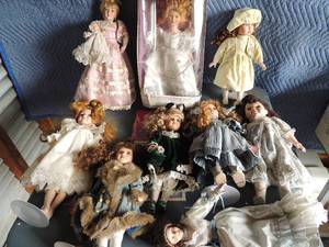 lot 143 image: Porcelain dolls in great condition 9 in total most with stands