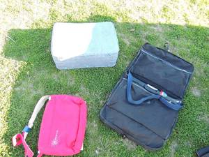 lot 169 image: Sky Blue Escort brand suitcase, Armond Dupree tote bag, Galla Coaler bag, Farnebu  black hanging bag.
