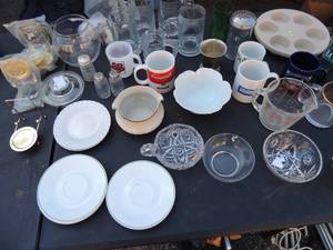 lot 57 image: Kitchen lot- Cups and saucers and holders, NIP measuring cups, candy dishes, 7 white with green trim Correlle saucers by corning