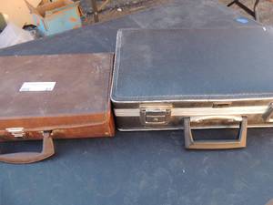 lot 61 image: Brown cassette case with assorted tapes including Helen Reddy, Glen Campbell, The Mills,Bros, Celine Dion and more. Black case with Immortal gentlemen, Golden age radio volume 2 featuring Duffys tavern