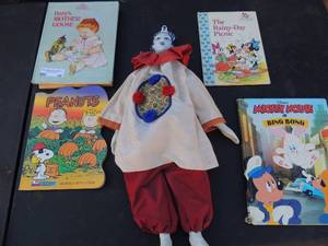 lot 66 image: Blue and white porcelain doll, various coloring books and reading books