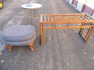 lot 70 image: Brown wicker table 26x 14 x17, decorative table 24 diameter 30 tall, blue ottoman with small white flowers print