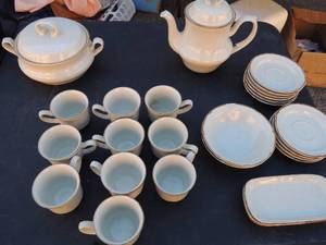 lot 72 image: Baroque Hearthside Stoneware dishes-  Tea Pot, 10 cups, 10 saucers, 2 butter dishes, and soup bowl with double handle and lid