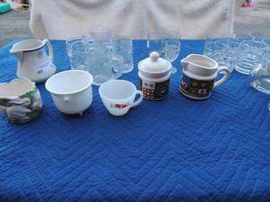 lot 82 image: 4 Christmas cups with horse and sleigh, Anchor Hocking Hi ball glasses, 2 glass batman and Flintstones cups sterling Verified China Creamer and more