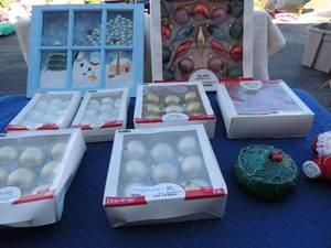 lot 92 image: Christmas lot- green glass Lefton bowl with lid, stuffed Santa, wall pic with snowman, 7 boxes of Christmas ornaments (NIB)