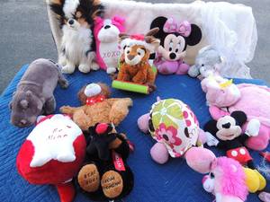 lot 98 image: Large lot of stuffed animals, Minnie Mouse, turtles, bears, frog, hippo and more. Includes a hanging net to keep them off the floor