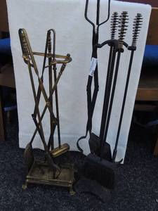 lot 100 image: 2 fire place sets. One gold and black the other black