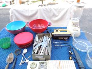 lot 103 image: Kitchen lot sunbeam blender,  sunbeam mixer with 2 bowls, large box of flatwear, kitchen egg slicer, strainer and more