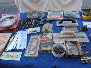 lot 104 image: Hardware includes Craftsman band saw blades,  bolts, nuts, screws, nails, saws, saw blades, grout floats, sandpaper and more