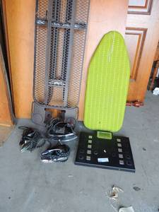lot 114 image: Brown metal ironing board, mini green ironing board      3 vintage Fostoria irons      my weight bathroom scale needs batteries