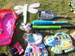 lot 117 image: Toy lot- V-tech alphabet learning game (works) baby doll bed, tennis rackets, 2 softball bats, NIB play sprinkler, Tonka Dump truck and more