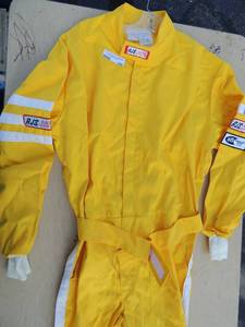 lot 190 image: Racing suit bright yelloe white stripe on sleeve RJS XL size suit new condition. No tears or stains Durable flame resistent