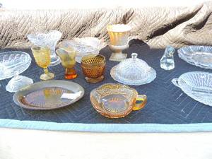 lot 196 image: Various pieces of clear and yellow glass flower vases, candy dish, serving platter, deviled egg plate and more