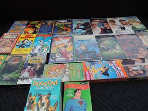 lot 232 image: Disney VHS lot includes kids cartoons, porky pig, milo and otis, the mask, Mrs. Doubtfire, Pinochio and many more
