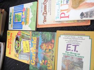 lot 237 image: Childrens books sticker books, coloring books, touch and feel puppy, ET, The dark crystal, Oscars rotten birthday, garfield, baby bop and barney, old mcdonald and many more
