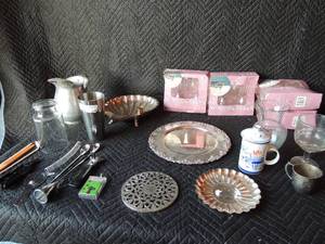 lot 256 image: 4 4 packs of plastic wine glasses NIP, Lunbar silver serving platter and other assorted silver pieces, mix drink tumbler stir spoons, beer bottle tap and egg poacher