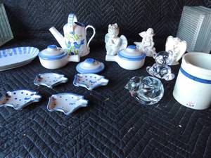lot 264 image: MA Hadley lot (7 PCS) and more- 4 spoon holders and MA Hadley pigs, pottery cannisters no lid lid blue trim crock on top, 2 MA Hadley soup bowls with handles and lids, 3 ceramic angels, 1 blue bird pitcher with 2 hanles and more