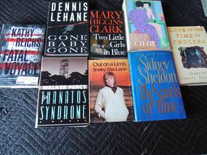 lot 272 image: Large red and green tote full of various hard back books including Walker Percy, Dennis Lehone, Shirley McLain, Sidney Sheldon, and manymore
