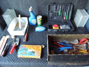 lot 276 image: Misc. house painting tools- stir sticks, paint rollars, lenoleum laying kit with screw drivers, metal tool box with some tools
