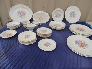 lot 343 image: Pope Gosser  rosepoint dish set 8 rose design dinner plates 1 rose serving platter 2 tea cups, 1 creamer 6 salad bowls 1 bread bowl 15 saucers 7 dessert bowls