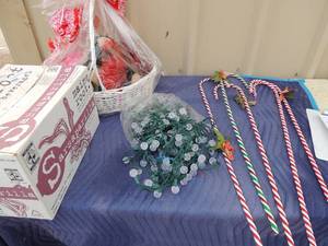 lot 363 image: Valentine basket and bear NIP, 5 candy canes stick holiday yard art, clear crystal christmas lights box of green christmas tinsel