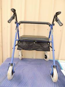 lot 368 image: Invacare large person walker with 4 wheels and hand brakes storage compartment under seat