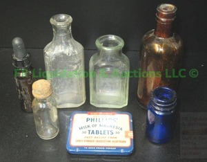 lot 182 image: Antique & Vintage medicine bottles and vintage Phillips Milk of Magnesia tablet tin