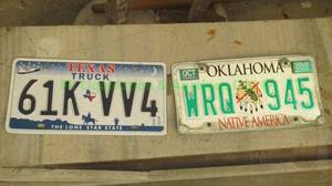 lot 219 image: Oklahoma & Texas license plates
