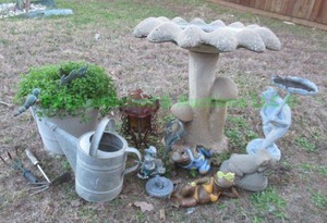 lot 259 image: Assorted garden decor including concrete bird bath plus
