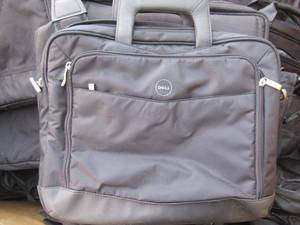 lot 3 image: LAPTOP COMPUTER BAGS IN ASSORTED SIZES AND MAKES. DELL, THINKPAD AND MORE IN LARGE BIN. FIRST CUSTOMER GETS FIRST PICK.