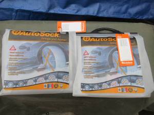 lot 148 image: AUTOSOCK TRACTION AND WHEEL COVER FOR ICE & SNOW. UNUSED IN UNOPENED PACKS. 2 PER BAG SEE PICTURES FOR TIRE SIZES