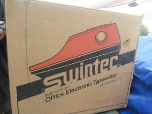 lot 182 image: MILITARY ISSUED SWINTEC TYPEWITER MODEL# 8014 UNUSED WITH ALL PAPERWORK NSN# 7430011166035