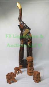 lot 15 image: Hand crafted wood animal figurines each with internal animal carved inside