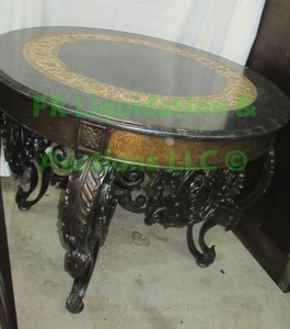 lot 4 image: Granite stone table with embossed inlay and ornate wrought iron base, 42 wide x 31 tall