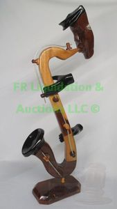 lot 32 image: Saxophone player figurial art piece solid wood carved, 21 tall