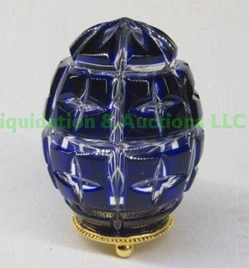 lot 194 image: Faberge blue crystal cut to clear egg on stand
