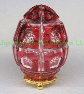 lot 192 image: Faberge red crystal cut to clear egg on stand