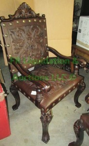 lot 72 image: Ornate Accent chair embossed leather seat & back on wood frame with oversized nail head trim, matches lot 73