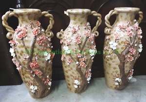 lot 242 image: Amphora style vases with floral embossed theme and rope twist handles 28 tall (one handle is broken)