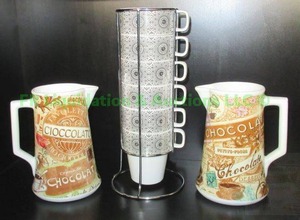 lot 186 image: Stacking cups with holder and chocolate pitchers