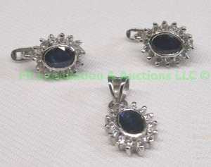lot 296 image: Sterling silver sapphire pendant and post earring set